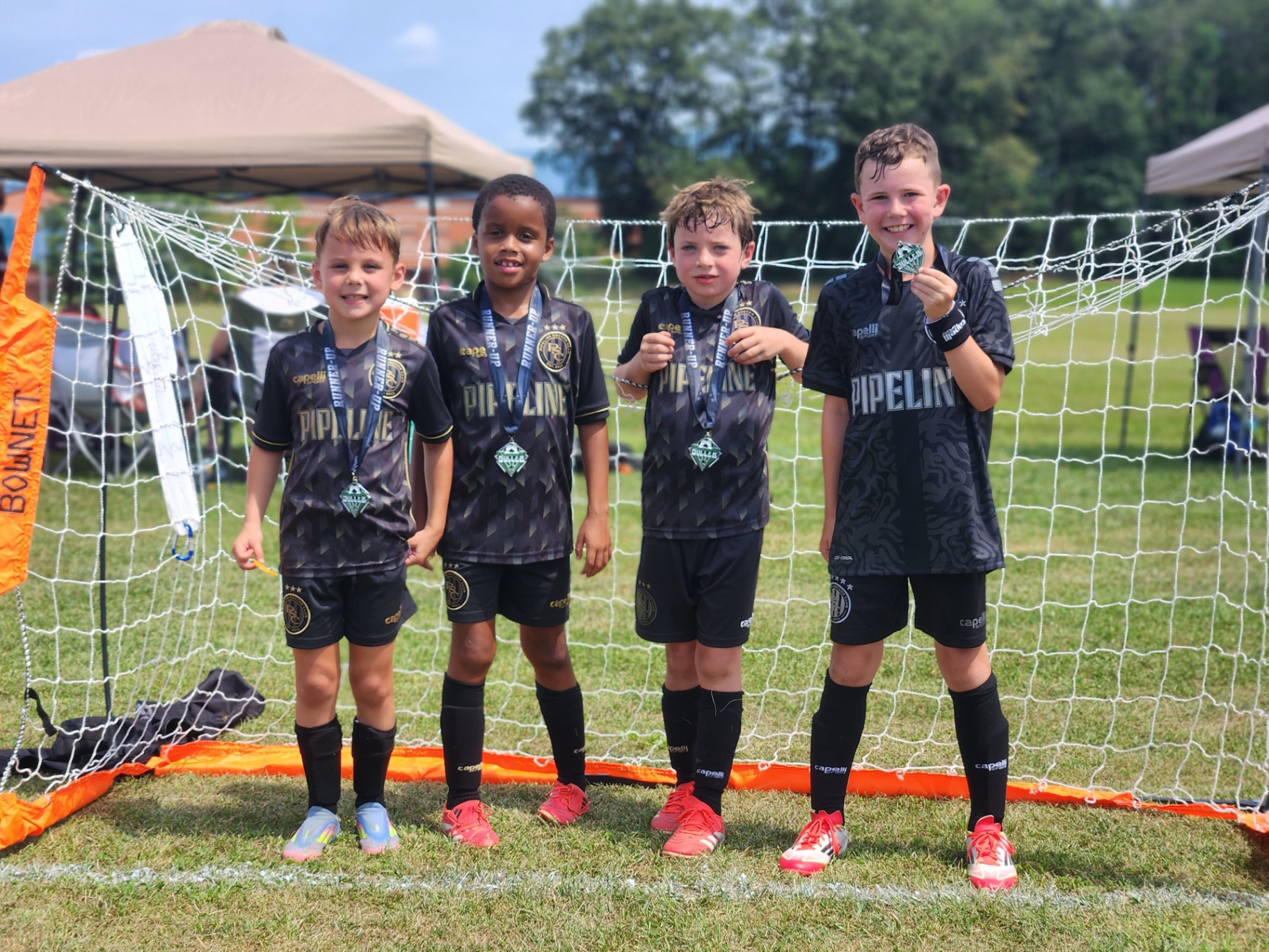 2025 — Pipeline SC boys runner-up team with their medals