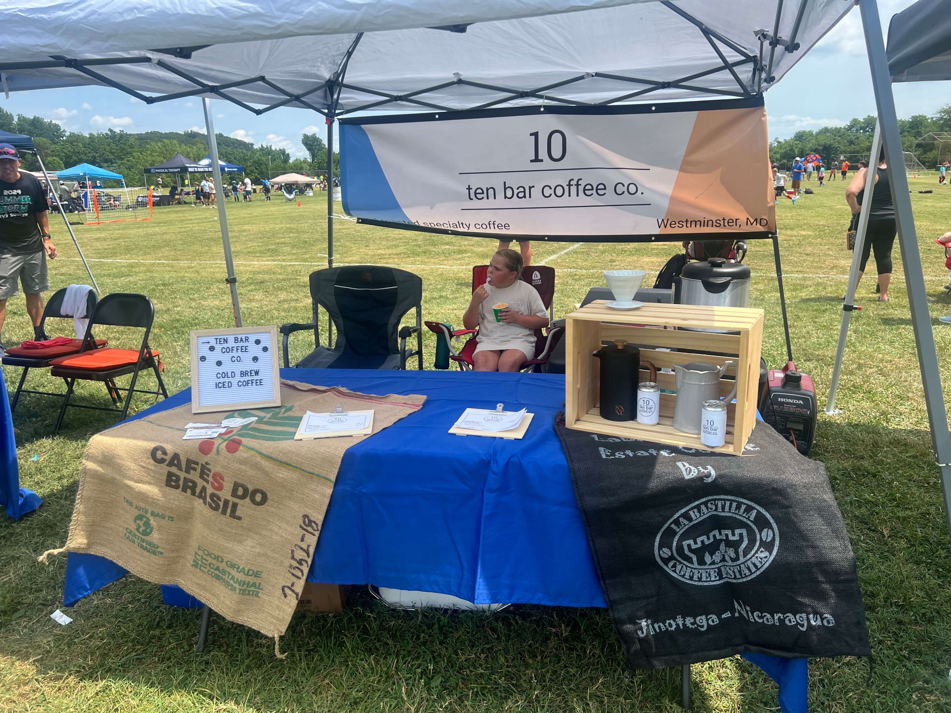 Ten Bar Coffee Co. tent serving cold brew at the tournament